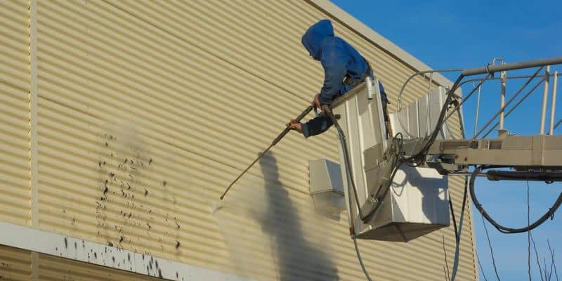 Pressure washing siding